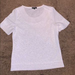 White dressy t shirt with paisley design on it